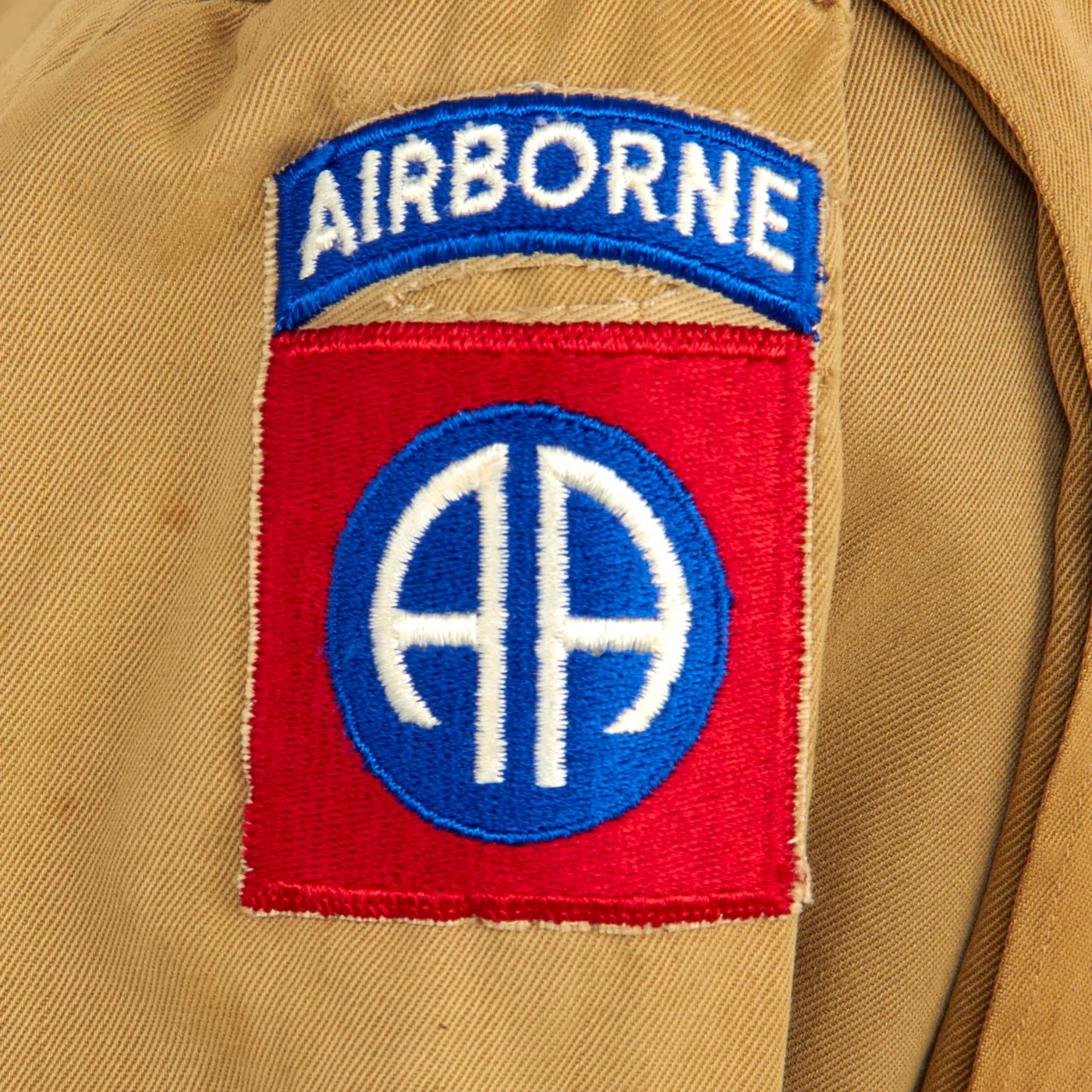 Original U.S. WWII M1942 Paratrooper Jump Jacket without Reinforcements with Added 82nd Airborne Division Shoulder Sleeve Insignia - Laundry Number Marked